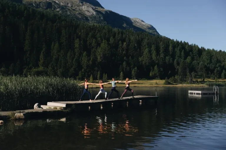 Yoga by a mountain lake