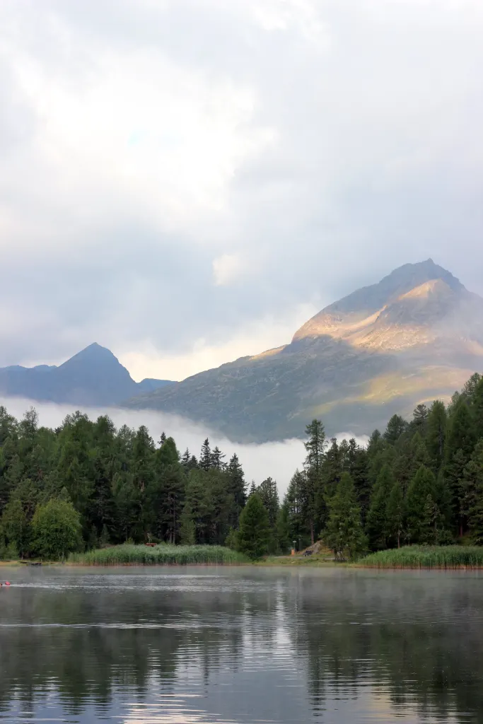 Mist over a mountain lake in the Engadin